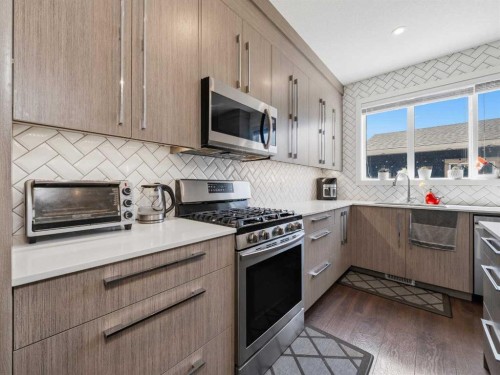 153 Chelsea Drive, Chestermere, AB - Indoor Photo Showing Kitchen With Upgraded Kitchen