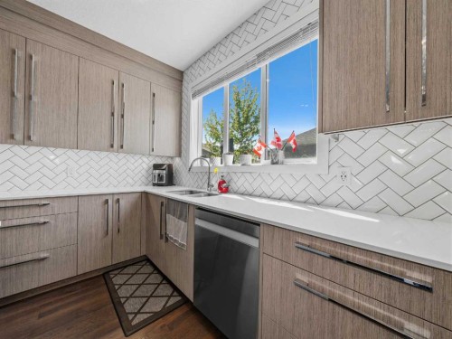 153 Chelsea Drive, Chestermere, AB - Indoor Photo Showing Kitchen With Double Sink