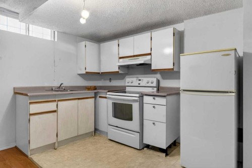 123 Rundleridge Way Ne, Calgary, AB - Indoor Photo Showing Kitchen With Double Sink