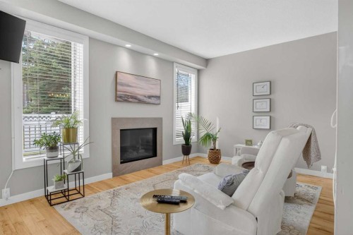12 Wood Crescent Sw, Calgary, AB - Indoor Photo Showing Living Room With Fireplace