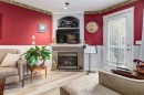 102 Cimarron Trail, Okotoks, AB  - Indoor Photo Showing Living Room With Fireplace 