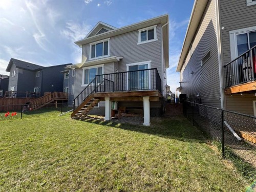 181 Buckskin Way, Cochrane, AB - Outdoor With Deck Patio Veranda With Exterior