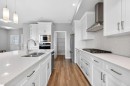 181 Buckskin Way, Cochrane, AB  - Indoor Photo Showing Kitchen With Double Sink With Upgraded Kitchen 