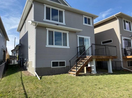181 Buckskin Way, Cochrane, AB - Outdoor With Deck Patio Veranda With Exterior