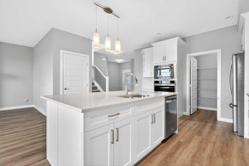 181 Buckskin Way, Cochrane, AB - Indoor Photo Showing Kitchen With Double Sink With Upgraded Kitchen