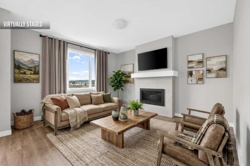 181 Buckskin Way, Cochrane, AB - Indoor Photo Showing Living Room With Fireplace