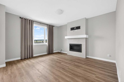 181 Buckskin Way, Cochrane, AB - Indoor Photo Showing Living Room With Fireplace