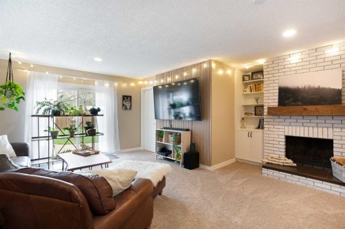 15 Bearberry Crescent Nw, Calgary, AB - Indoor Photo Showing Living Room With Fireplace