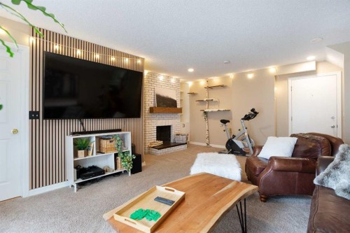 15 Bearberry Crescent Nw, Calgary, AB - Indoor Photo Showing Living Room With Fireplace