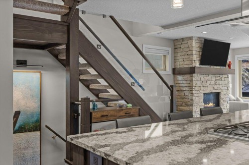 2-817 4Th Street, Canmore, AB - Indoor With Fireplace
