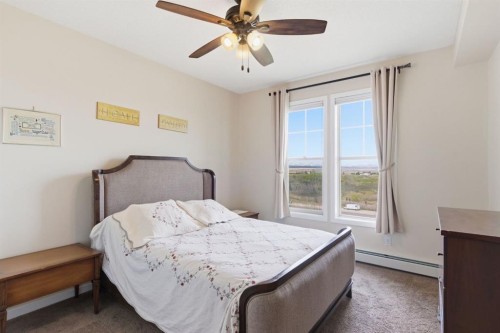 408-207 Sunset Drive, Cochrane, AB - Indoor Photo Showing Bedroom