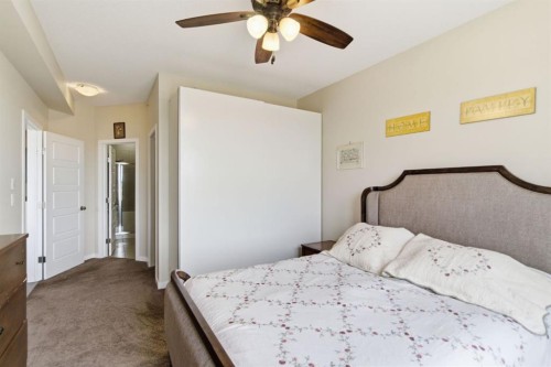 408-207 Sunset Drive, Cochrane, AB - Indoor Photo Showing Bedroom