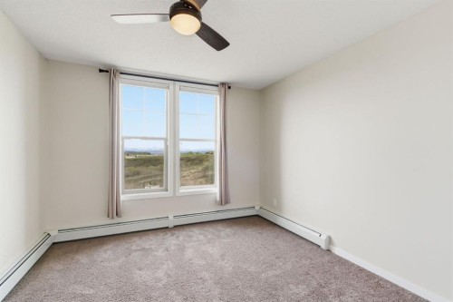408-207 Sunset Drive, Cochrane, AB - Indoor Photo Showing Other Room