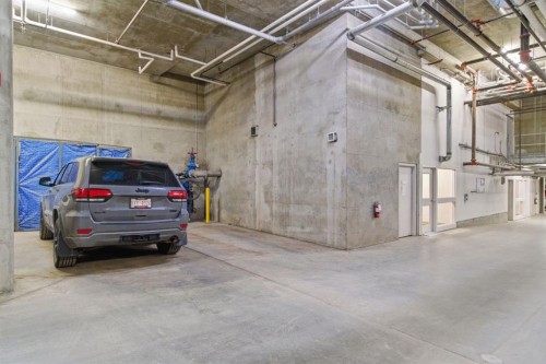 408-207 Sunset Drive, Cochrane, AB - Indoor Photo Showing Garage
