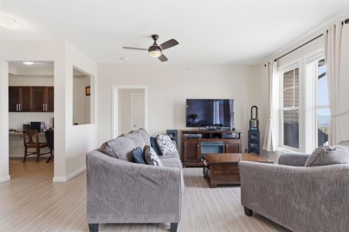 408-207 Sunset Drive, Cochrane, AB - Indoor Photo Showing Living Room
