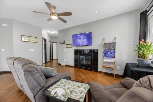 107 Westridge Place, Didsbury, AB - Indoor Photo Showing Living Room With Fireplace