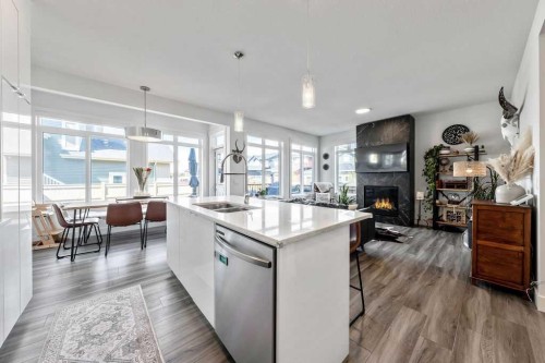 29 Sundown Close, Cochrane, AB - Indoor Photo Showing Kitchen With Fireplace With Double Sink