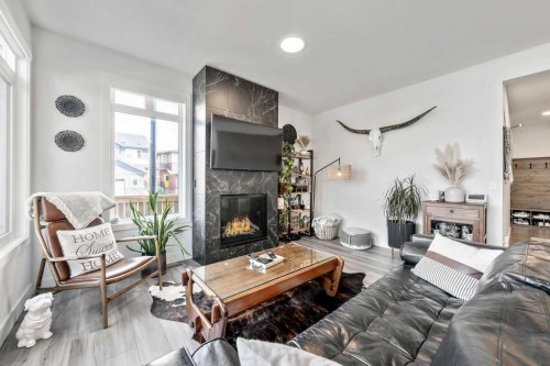 29 Sundown Close, Cochrane, AB - Indoor Photo Showing Living Room With Fireplace