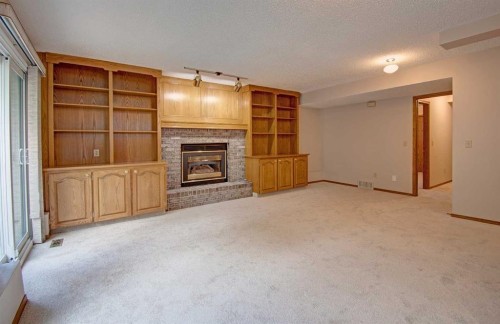 345 Sandringham Court Nw, Calgary, AB - Indoor With Fireplace
