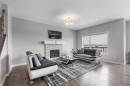 247 Hillcrest Heights Sw, Airdrie, AB  - Indoor Photo Showing Living Room With Fireplace 