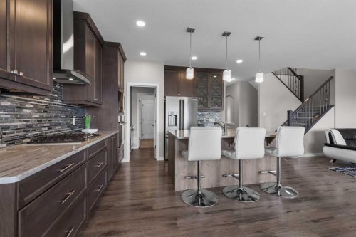 247 Hillcrest Heights Sw, Airdrie, AB - Indoor Photo Showing Kitchen With Upgraded Kitchen