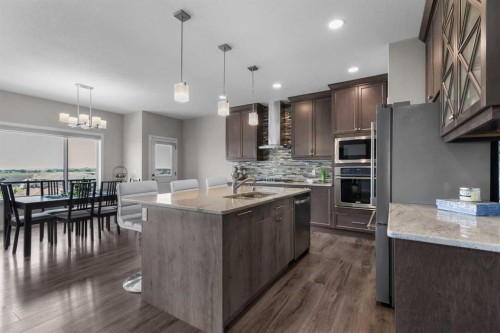 247 Hillcrest Heights Sw, Airdrie, AB - Indoor Photo Showing Kitchen With Upgraded Kitchen