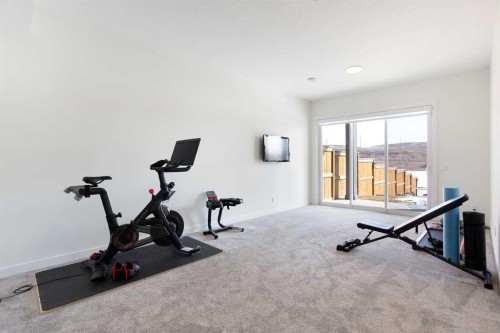 152 Cranbrook Gardens Se, Calgary, AB - Indoor Photo Showing Gym Room