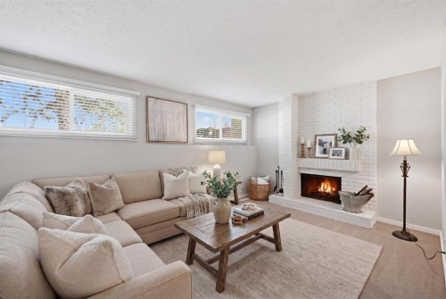 156 Templeview Place Ne, Calgary, AB - Indoor Photo Showing Living Room With Fireplace