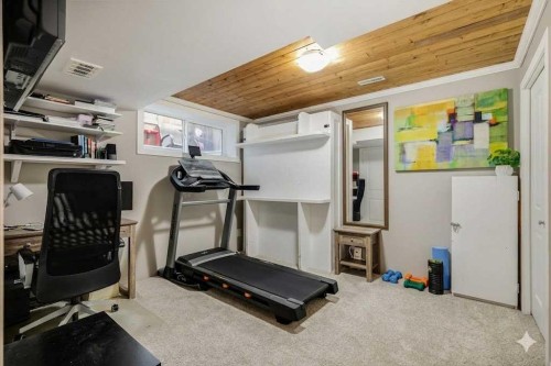 1065 Kingston Crescent Se, Airdrie, AB - Indoor Photo Showing Gym Room