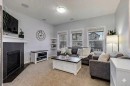 1065 Kingston Crescent Se, Airdrie, AB  - Indoor Photo Showing Living Room With Fireplace 