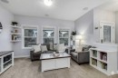1065 Kingston Crescent Se, Airdrie, AB  - Indoor Photo Showing Living Room 