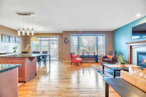 8 Sunset Square, Cochrane, AB - Indoor Photo Showing Living Room With Fireplace