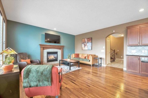 8 Sunset Square, Cochrane, AB - Indoor Photo Showing Living Room With Fireplace