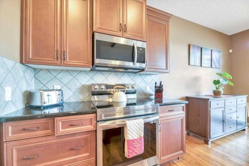 8 Sunset Square, Cochrane, AB - Indoor Photo Showing Kitchen
