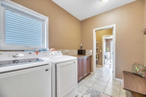 8 Sunset Square, Cochrane, AB - Indoor Photo Showing Laundry Room