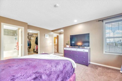 8 Sunset Square, Cochrane, AB - Indoor Photo Showing Bedroom