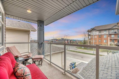 8 Sunset Square, Cochrane, AB - Outdoor With Balcony With Exterior