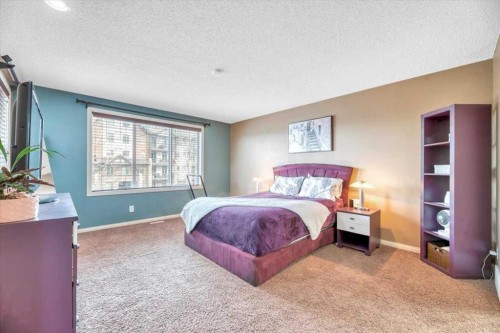 8 Sunset Square, Cochrane, AB - Indoor Photo Showing Bedroom