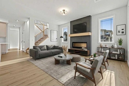 571 Buffaloberry Manor Se, Calgary, AB - Indoor Photo Showing Living Room With Fireplace