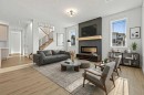 571 Buffaloberry Manor Se, Calgary, AB  - Indoor Photo Showing Living Room With Fireplace 