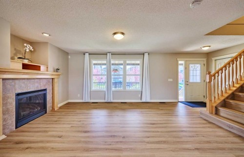 383 Prestwick Close Se, Calgary, AB - Indoor Photo Showing Living Room With Fireplace