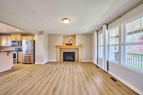 383 Prestwick Close Se, Calgary, AB - Indoor With Fireplace