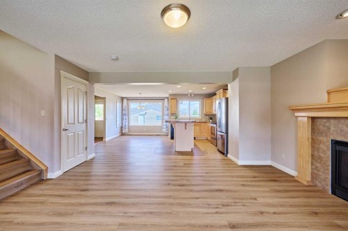 383 Prestwick Close Se, Calgary, AB - Indoor Photo Showing Living Room With Fireplace