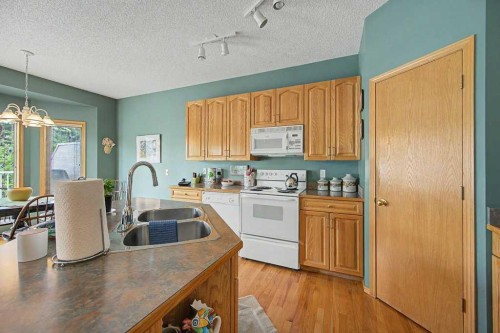 18 Prominence View Sw, Calgary, AB - Indoor Photo Showing Kitchen With Double Sink