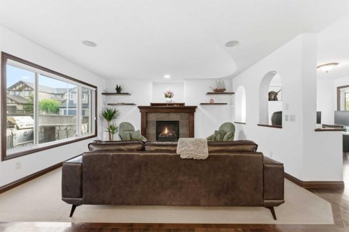 225 Panamount Road, Calgary, AB - Indoor Photo Showing Living Room With Fireplace