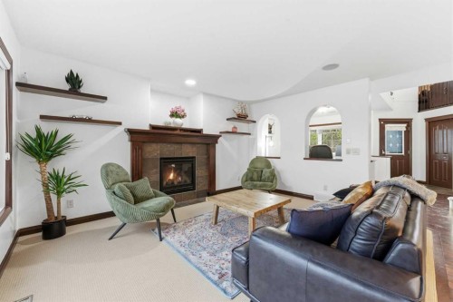 225 Panamount Road, Calgary, AB - Indoor Photo Showing Living Room With Fireplace