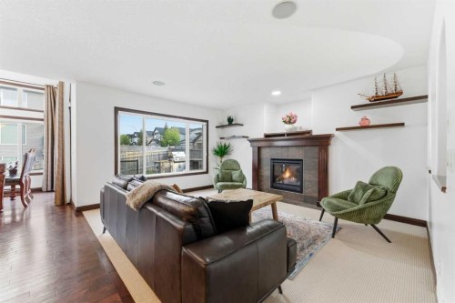 225 Panamount Road, Calgary, AB - Indoor Photo Showing Living Room With Fireplace