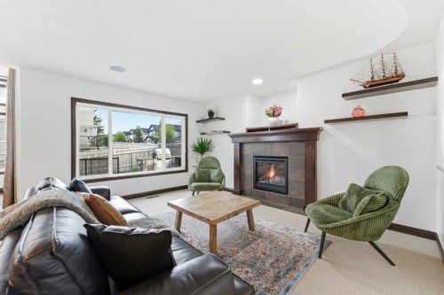 225 Panamount Road, Calgary, AB - Indoor Photo Showing Living Room With Fireplace