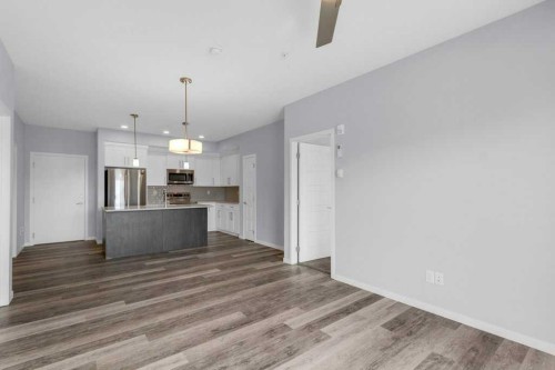 323-4150 Seton Drive Se, Calgary, AB - Indoor Photo Showing Kitchen