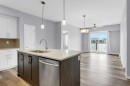 323-4150 Seton Drive Se, Calgary, AB  - Indoor Photo Showing Kitchen With Double Sink With Upgraded Kitchen 